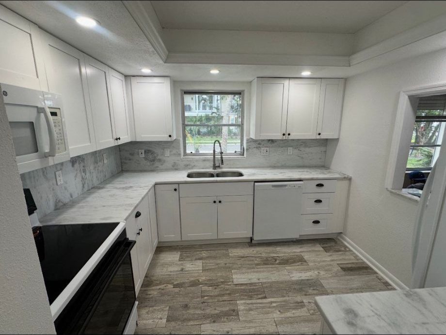 Finished kitchen remodel with white cabinets