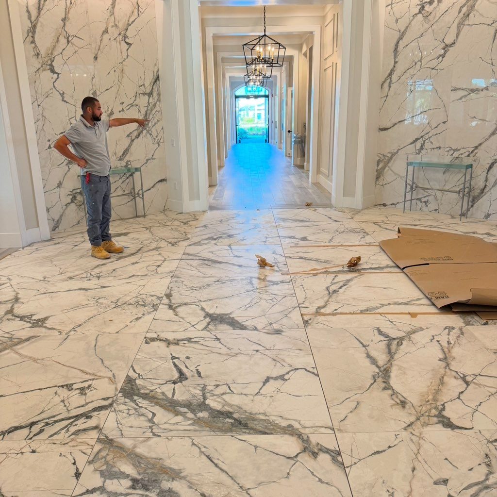 Large format marble tile hallway installation
