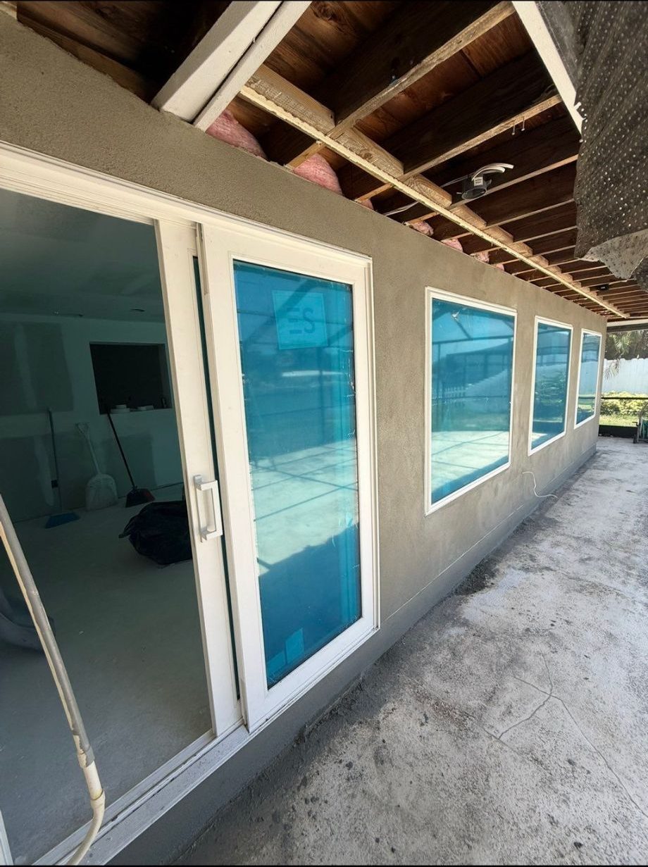 New sliding doors and windows with fresh stucco